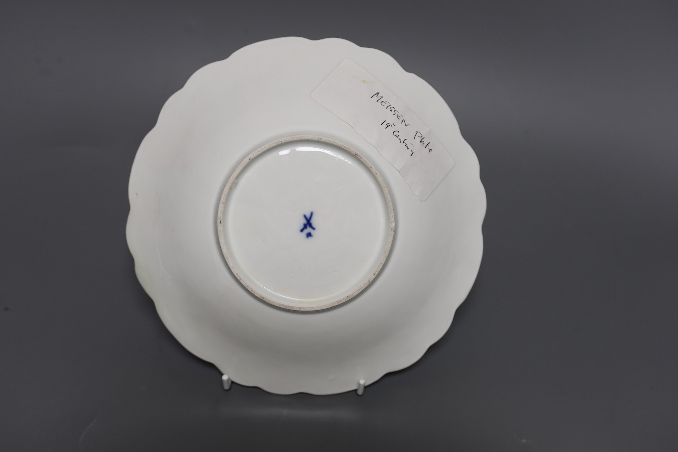 A Mesissen gilt decorated moulded dish, 21.5 cms diameter